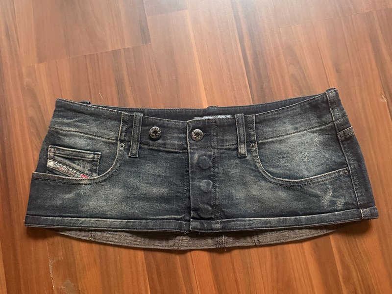 Raw phone photo of skirt on floor